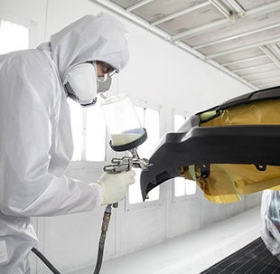 Collision Center Technician Painting a Vehicle | Stephen Toyota in Bristol CT
