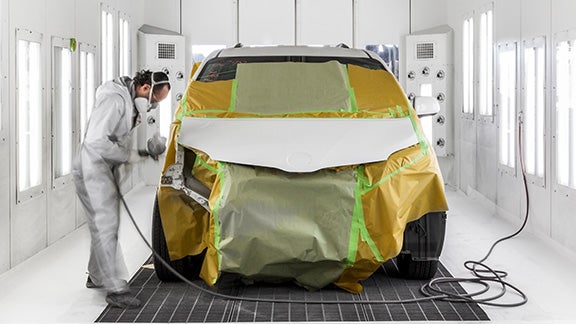 Collision Center Technician Painting a Vehicle | Stephen Toyota in Bristol CT